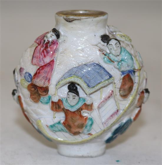 A Chinese famille rose moulded porcelain snuff bottle, Qianlong mark, c.1821-50, height 6.2cm